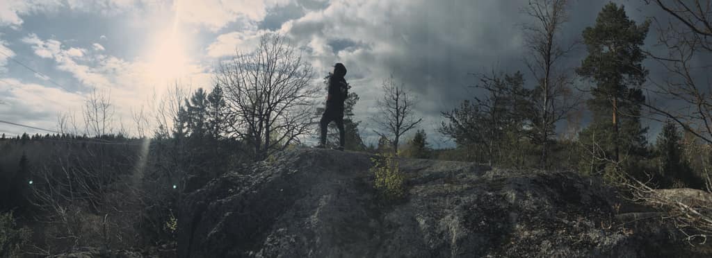 Mikael Melander on a clifftop in the forest outside Stockholm